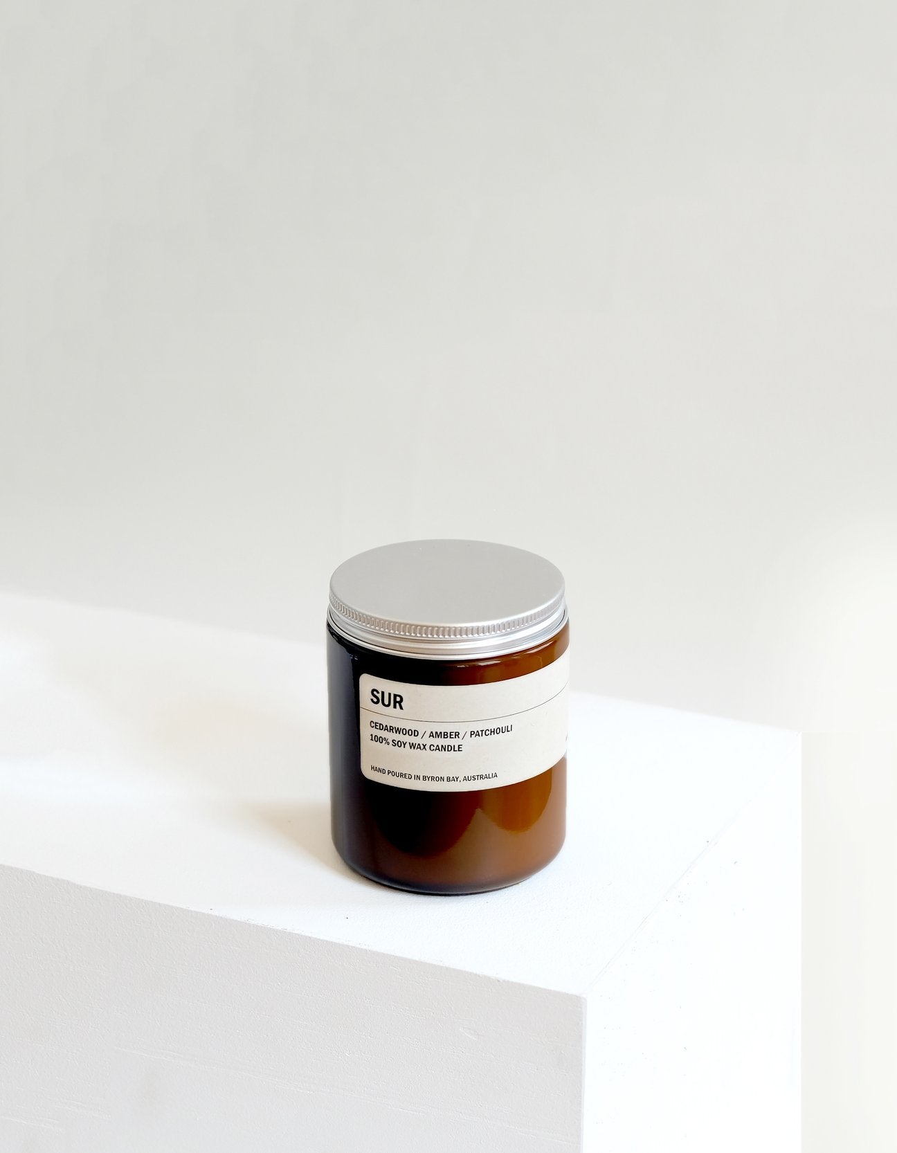 SUR:  CEDARWOOD / AMBER / PATCHOULI SMALL AMBER CANDLE 250G
